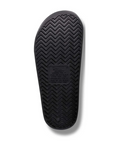 Black wave tread pattern outsole with Archies logo in middle.