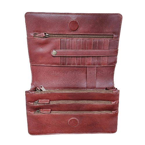Inside Whiskey leather cross body bag showing multiple compartments and card slots