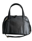 Black leather handbag with stitched lines, detachable shoulder strap and thick handles.