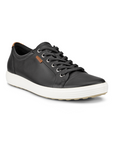 Black leather upper sneaker with a brown Ecco logo tag near the white laces and a white midsole and a beige outsole.