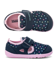 Pair of Navy children's shoes with colorful polka dots, pink Merrell logo'd footbed and pink outsole..