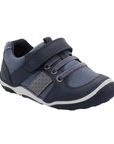 Leather sneaker in navy with hook-and-loop strap, suede accents and detail stitching.