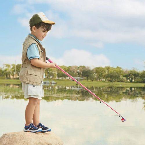 Toddler wearing navy Stride Rite Wade 2.0 Sandals while fishing outdoors, showcasing water-friendly comfort and rugged design for active play.