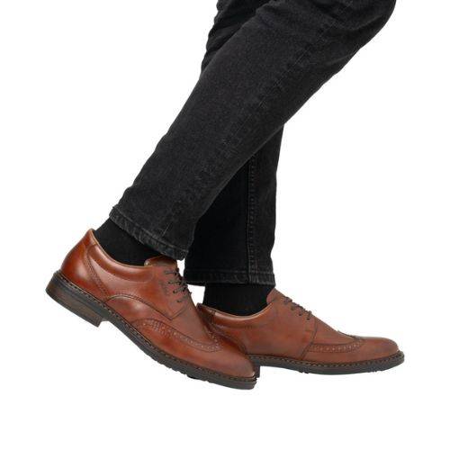 Brown Rieker L7620 Baroque Dress Shoes paired with black jeans, demonstrating their refined look and everyday versatility for men.