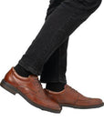 Brown Rieker L7620 Baroque Dress Shoes paired with black jeans, demonstrating their refined look and everyday versatility for men.