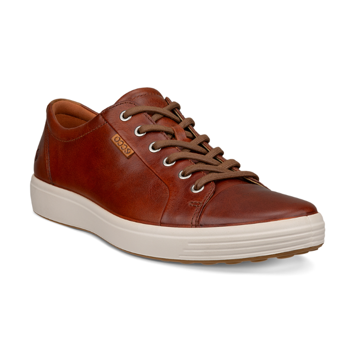 A cognac nubuck casual sneaker with a white midsole and brown outsole. A brown leather tag near the laces show the Ecco logo.