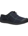 Howser III Clog in Navy. A slip-on shoe with a blue plaid textile upper, featuring an elastic bungee closure around the heel. Outsole is black.
