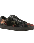 Black lace-up shoe with metallic red and green rose pattern, a black outsole, and black laces.