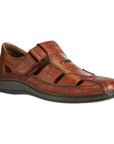 Brown leather fisherman sandal with Velcro closure and dark brown outsole.