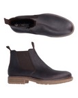 Pair of Black leather chelsea boots with elastic side panels, pull tabs, side zipper, black Rieker logo'd footbed and tan outsole.