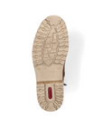 Beige light treaded outsole of boot with red Rieker logo on heel.