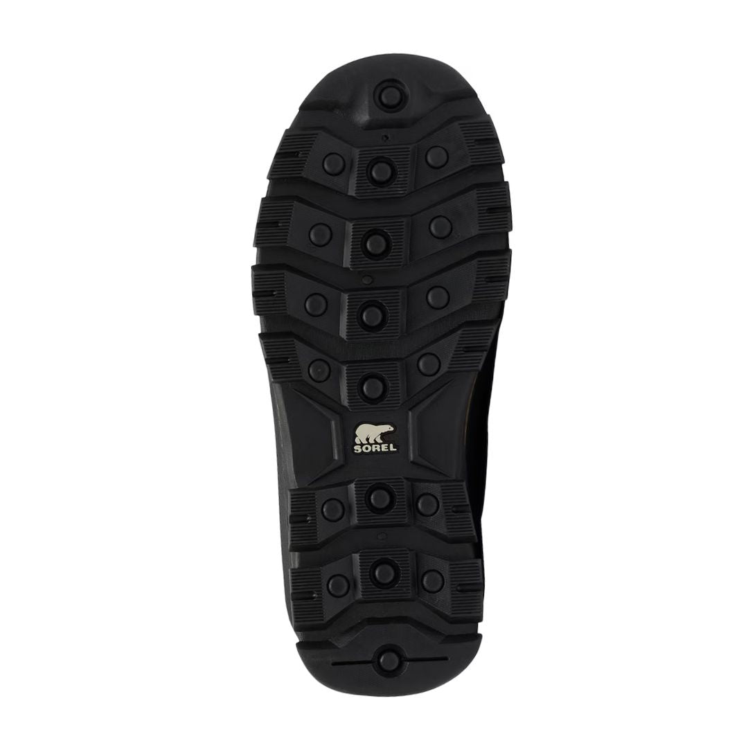 Close-up of the rugged black rubber outsole on men's Sorel Buxton winter boots, designed for traction in snowy and icy conditions.