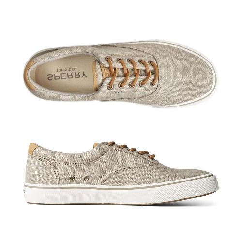 Beige canvas sneakers with white soles and brown laces, showcasing their comfort and durability from top and side views.
