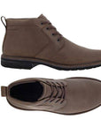 A pair of Brown leather low-heel boots with detailed stitching, brown laces, waterproof stamped at heel, light brown stitches on mid-sole with dark brown outsole.