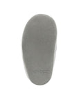 Grey suede outsole of baby shoe.