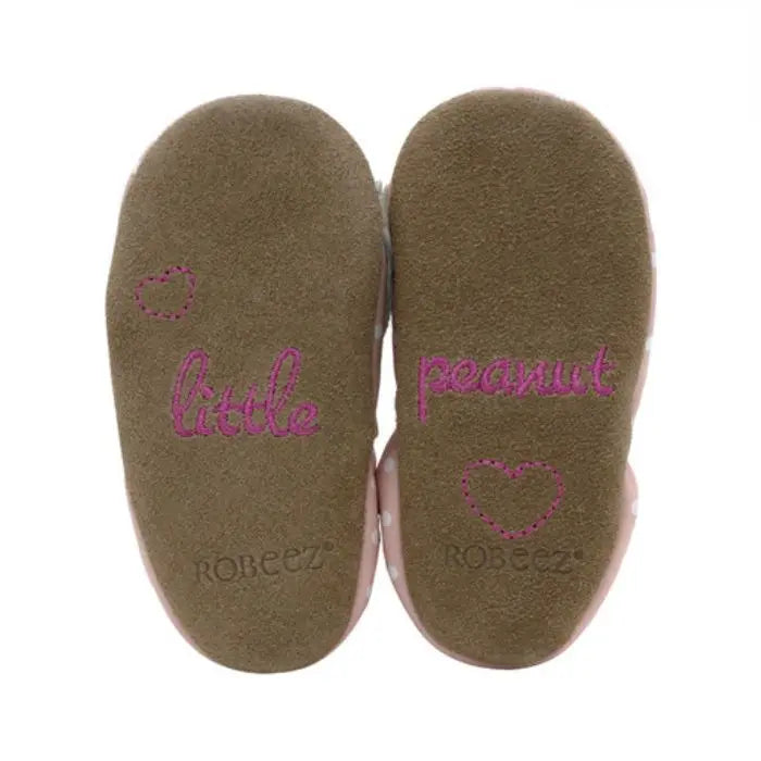 Suede soles of Robeez Little Peanut Soft Soles baby shoes with embroidered 'little peanut' text, promoting barefoot-like comfort for infants.