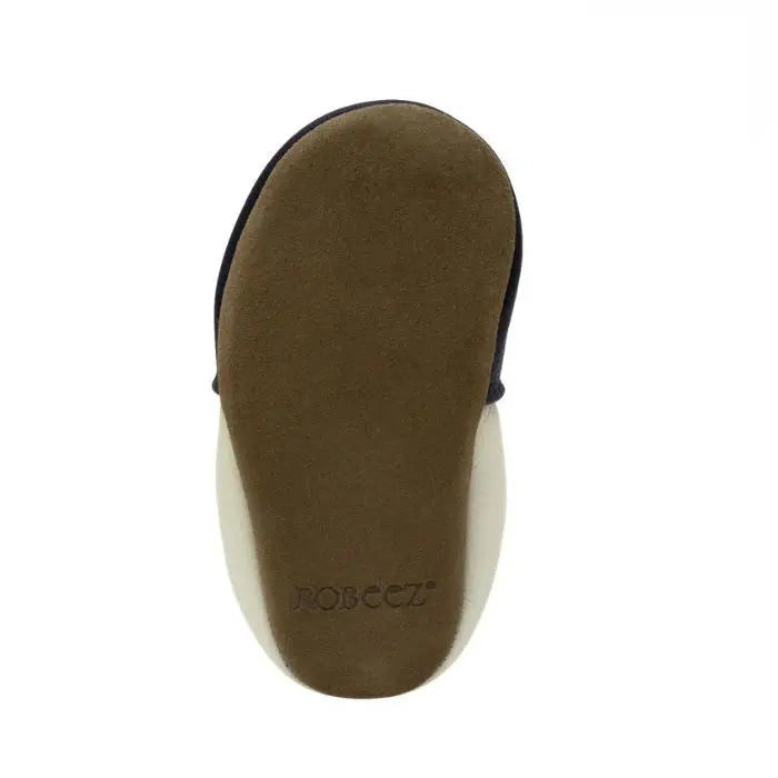 Bottom view of Robeez Shine Bright Soft Sole baby shoes showing flexible suede outsole for barefoot-like comfort.