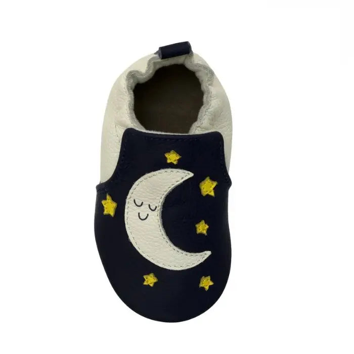 Top view of Robeez Shine Bright Soft Sole baby shoes featuring a smiling moon and yellow stars on navy leather.