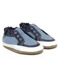 Blue denim and leather baby shoes with fake eyelets stitched on.