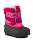 Kids Sorel Snow Commander Winter Boot in pink with black waterproof sole, fleece lining, and Velcro strap for easy fit and warmth.