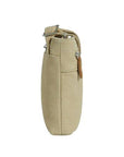 Side profile of the Heritage Anti-Theft Crossbody Bag in beige, showcasing its slim, compact shape ideal for travel and errands.