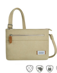 Heritage Anti-Theft Crossbody Bag in beige with RFID protection, lockable zipper, and slash-resistant strap for secure travel and daily use.