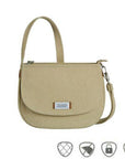 Beige Travelon Anti-Theft Crossbody Saddle Bag with RFID pockets and lockable zippers, ideal for secure travel and everyday use.