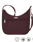 Travelon Anti-Theft Essentials East/West Small Hobo in burgundy with front zipper pocket and anti-theft icons, ideal for secure travel.