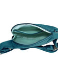 Teal blue Travelon Anti-Theft Roam Compact Sling interior showing organized compartments and light-colored lining.