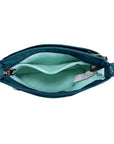 Interior view of teal Travelon Anti-Theft Roam Crossbody Bag showing organized compartments and light lining for visibility.
