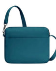 Back of teal Travelon Anti-Theft Roam E/W Crossbody Bag with clean lines and adjustable strap for versatile travel wear.