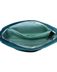 Interior of teal Travelon Anti-Theft Roam E/W Crossbody Bag showing light blue lining and multiple compartments for organization.
