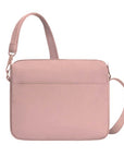Back view of blush pink Travelon Anti-Theft Roam E/W Crossbody Bag with sleek design and adjustable strap for hands-free travel.