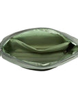 Interior of sage green Travelon Anti-Theft Roam E/W Crossbody Bag featuring RFID-blocking lining and organized compartments.