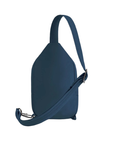 Back of ocean blue sling bag with an adjustable strap.