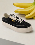MOEA Gen4 Banana Sneakers placed beside fresh bananas, symbolizing the vegan, banana-based materials used in these sustainable women's shoes.
