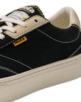 Close-up of MOEA Gen4 Banana Sneakers highlighting the yellow MOEA logo tag and detailed stitching on the eco-friendly vegan upper.