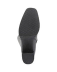 Black treaded outsole with block heel.