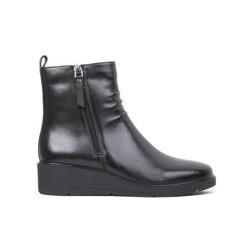 Black leather ankle boot with inside zipper closure and wedge outsole.