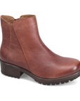 Brown leather ankle boot with lugged outsole and slight block heel.