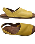 Top and side views of yellow Bueno Hayden Sandal, featuring a soft leather upper and flexible sole for all-day comfort.