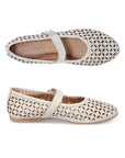 Pair of Mary Jane Flats in white leather with floral laser-cut design, Velcro strap, tan Bueno footbed and tan outsole.