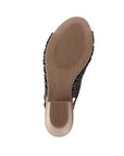Brown outsole of the Lacey sandal in black. Textured slightly for grip.
