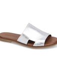 Women's Bueno Hendrix Slide Sandal in metallic silver with soft leather upper, cushioned insole, and flexible flat outsole for all-day comfort.
