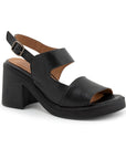 Black leather heeled sandal with platform outsole. Features an adjustable backstrap with pewter buckle.