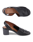 Pair of Black open-toe slingback sandals with tan Bueno logo'd footbed and stacked block heel.