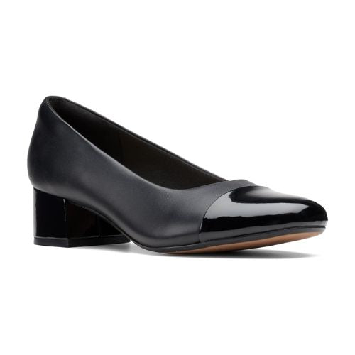 Black pump with patent toe cap and patent low heel.