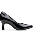 Black patent leather kitten heel with pointed toe and black rubber outsole.