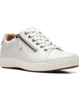 White sneaker with lace and side zipper closure.