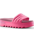 Pool Party slide sandal in Berry. A magenta 1.5 inch platform sandal with deep grooves on the outsole.